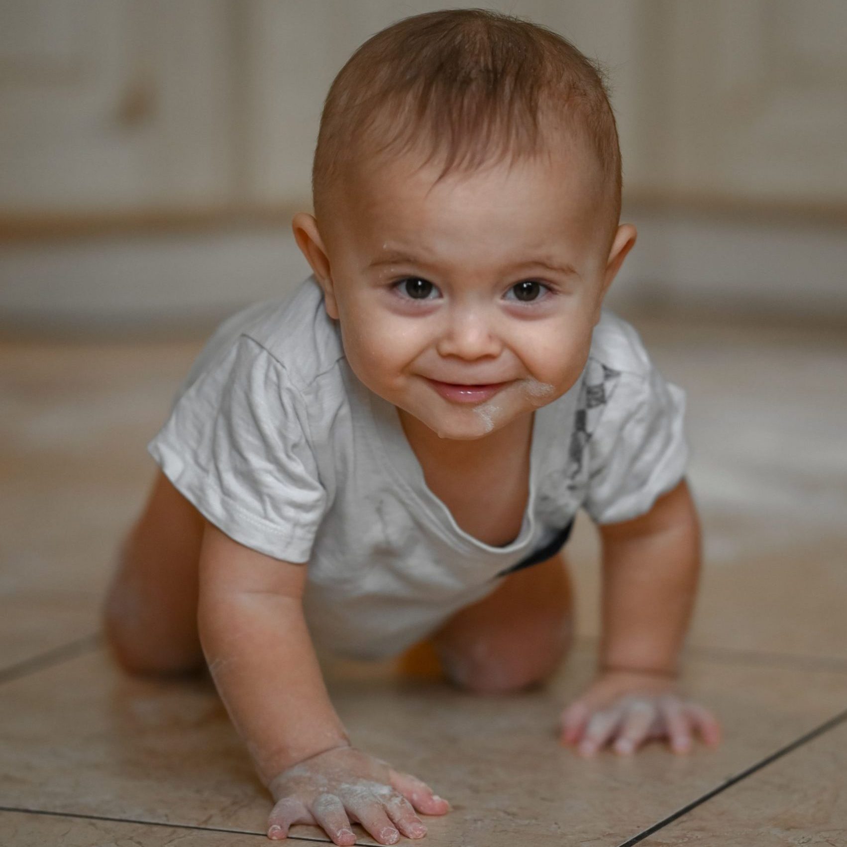 the-baby-at-home-in-the-kitchen-got-dirty-in-flour-2024-12-06-07-14-25-utc gateo